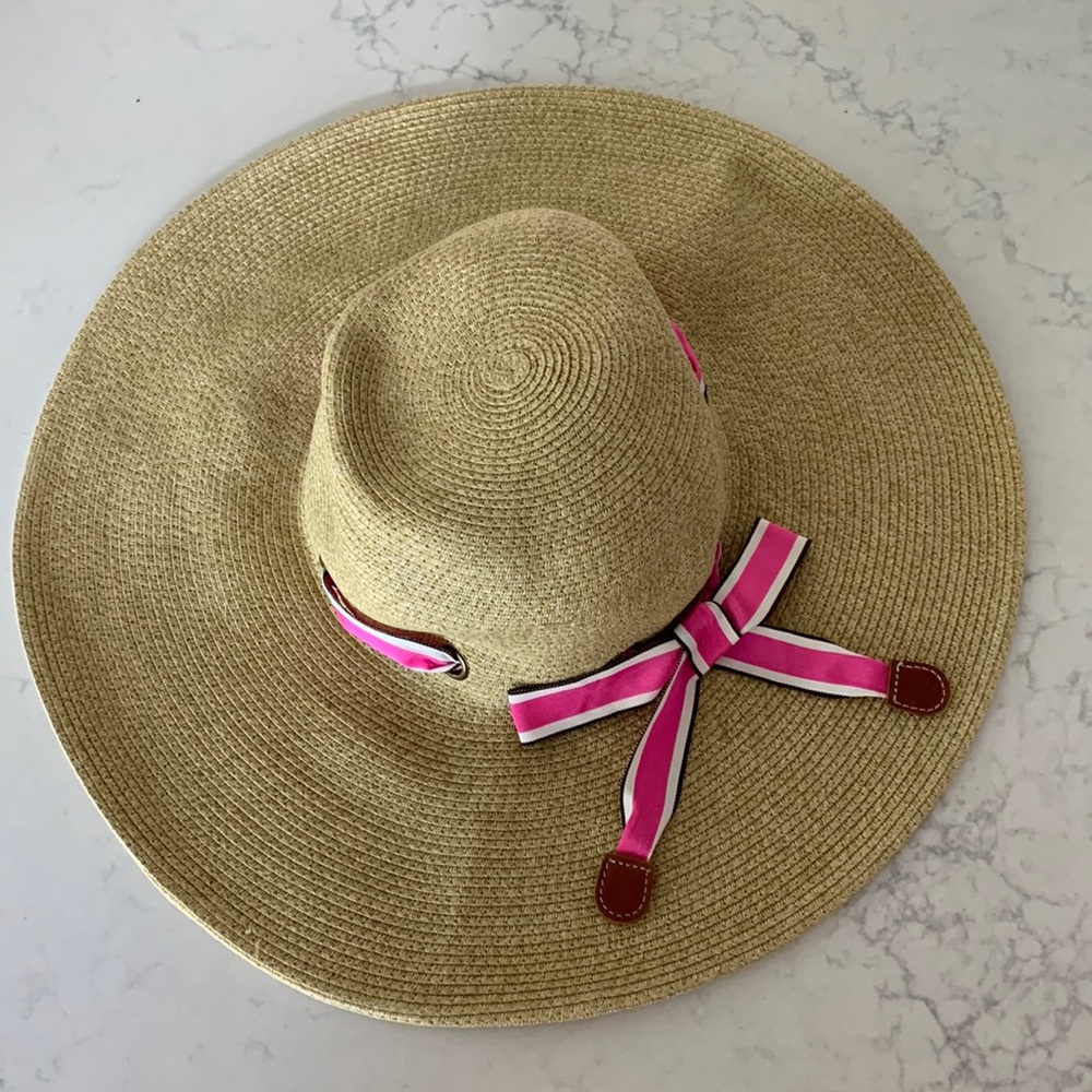 J crew floppy straw sun hat with pink and white striped bow.